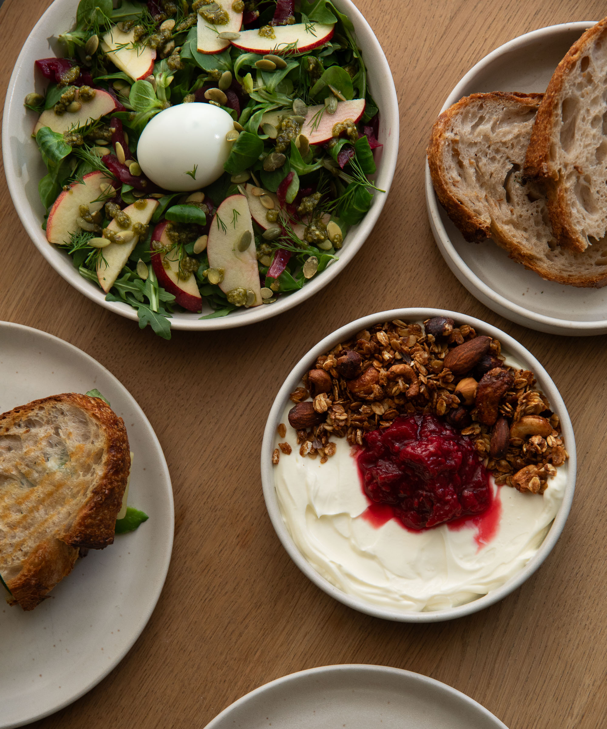 Pick whatever you like at KALA — Stacked sourdough toasts, matcha lattes, and fresh bakes make this cozy café a Nørrebro staple