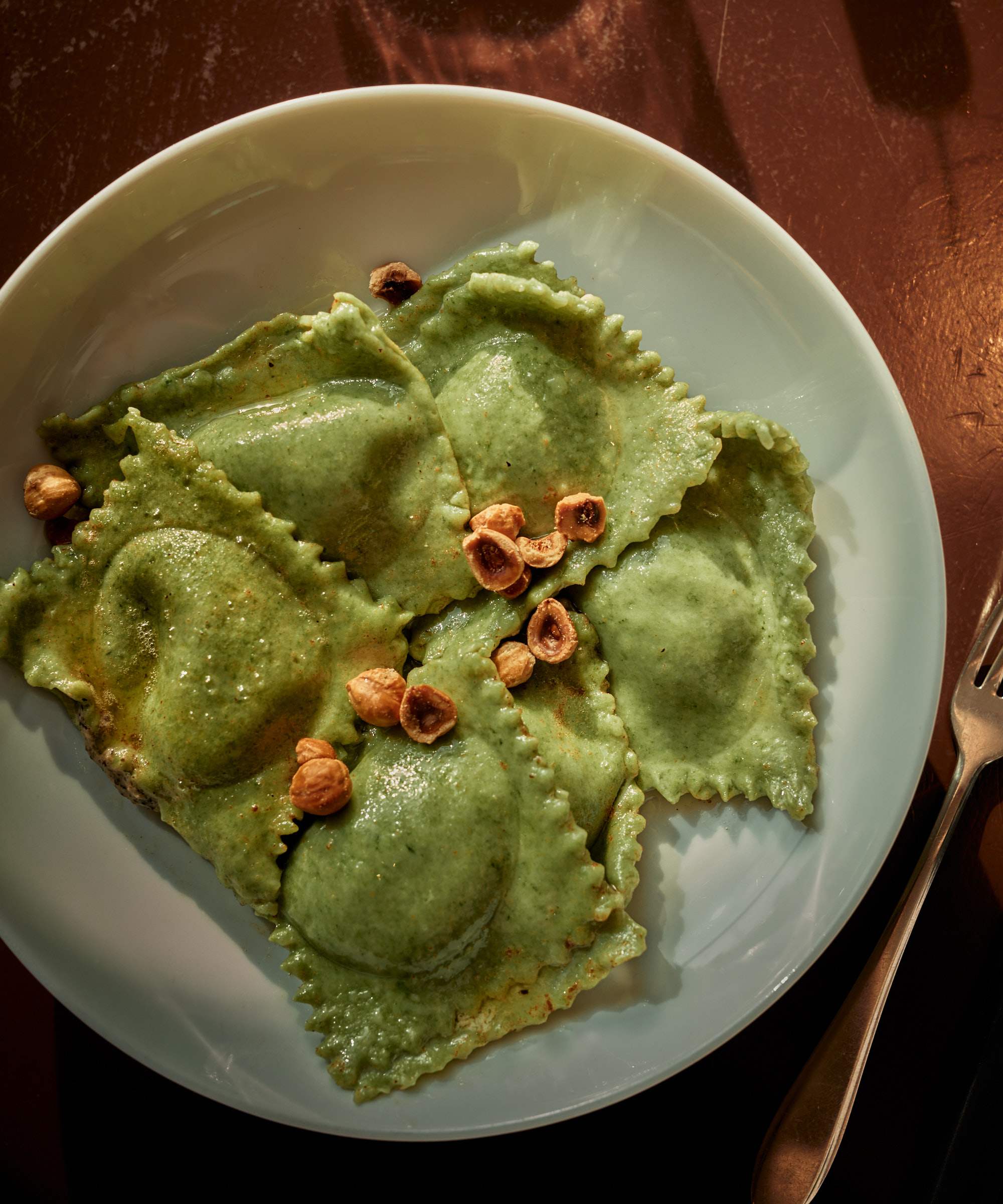 Pick whatever you like at Papillon in Amsterdam Noord — Croissants, sourdough pizzas, and handmade pastas keep this all-day spot in constant motion