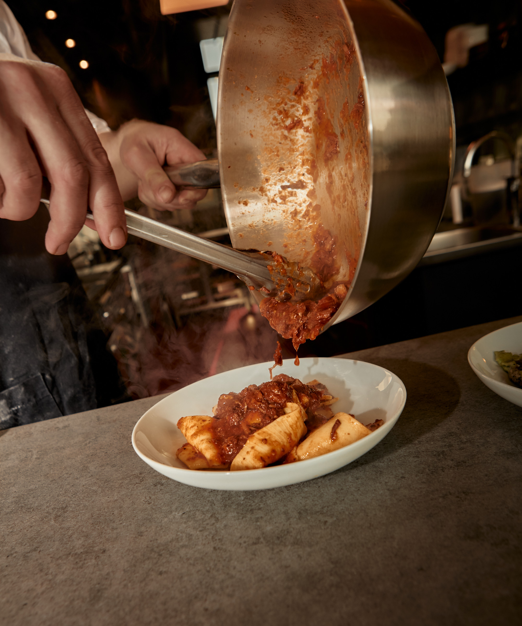 Pick whatever you like at Papillon in Amsterdam Noord — Croissants, sourdough pizzas, and handmade pastas keep this all-day spot in constant motion